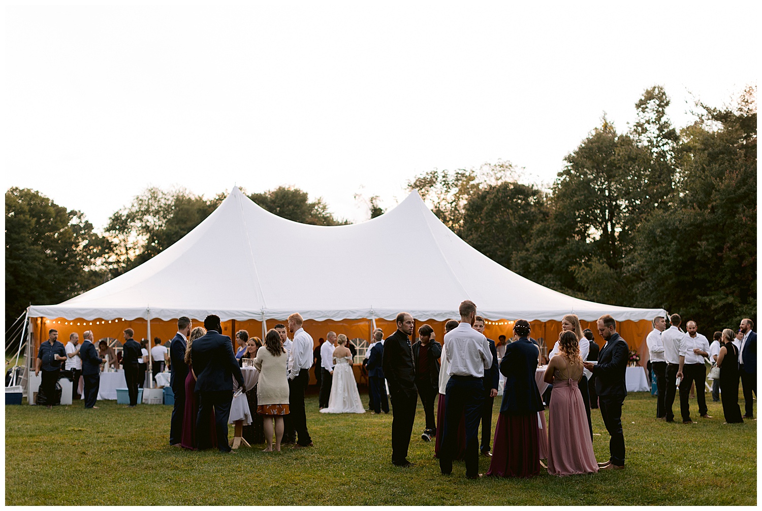 family and friends enjoying the evening under the tent